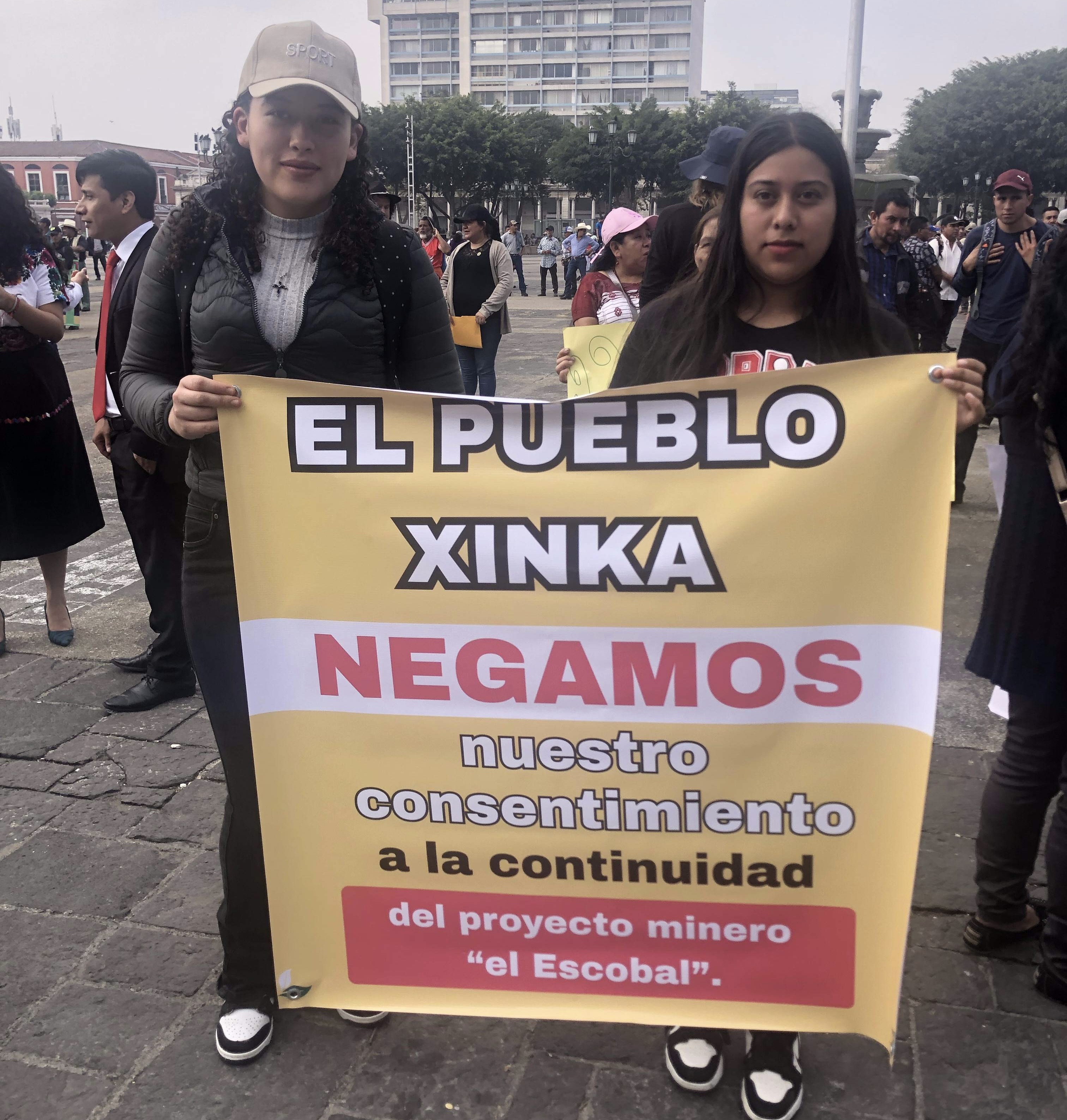 Two women hold a sign at a Xinka demonstration in Guatemala city announcing the results of a historic consultation process.