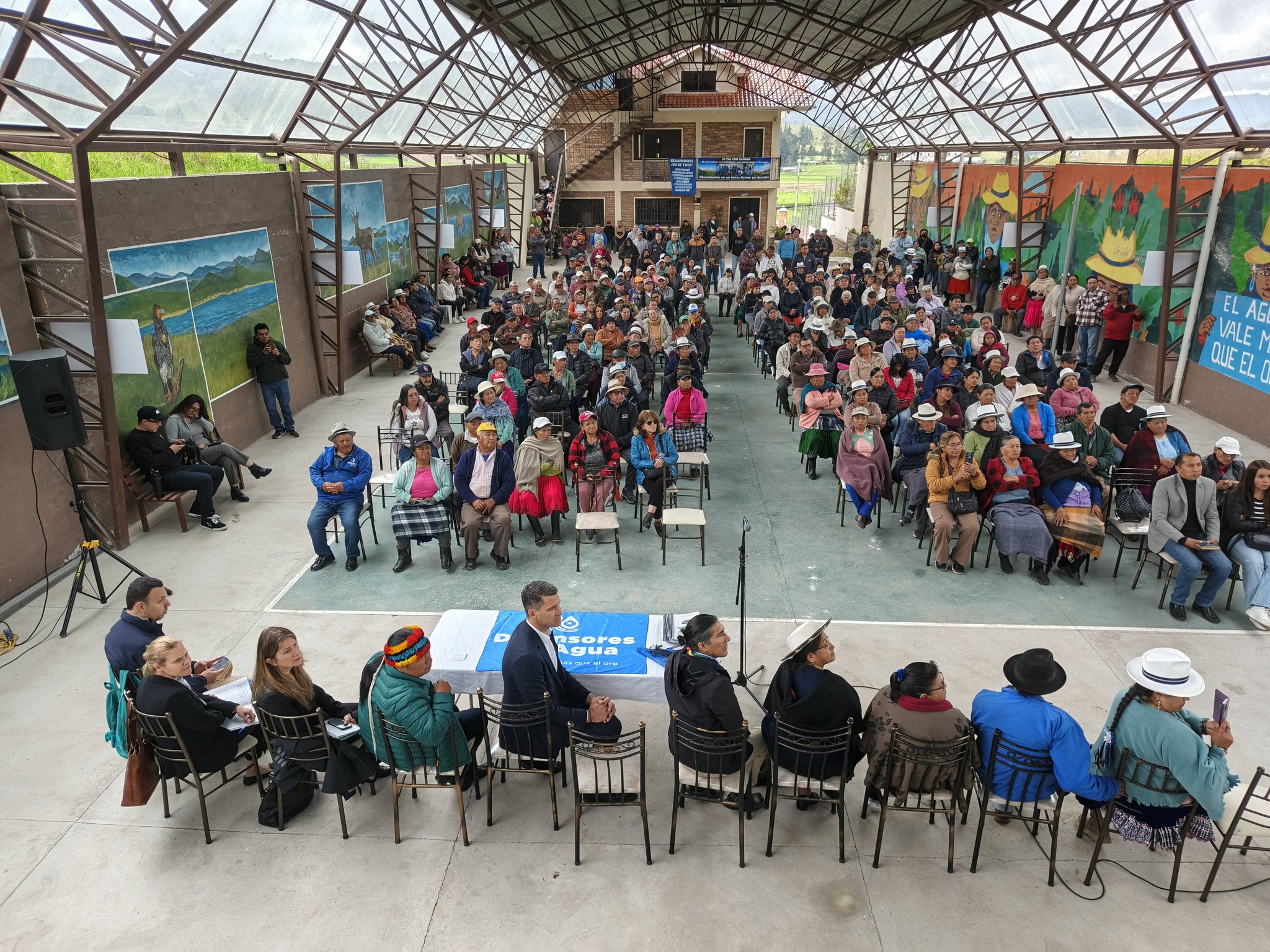 Indigenous and campesino community members gather to meet with the Canadian ambassador to discuss their concerns about mining in the Kimsakocha paramo.