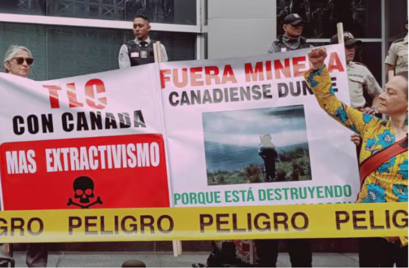 Protesters gather outside the Canadian embassy in Quito on March 4, 2026. “Free Trade Agreement with Canada—More extractivism,” reads the banner. Photo by Acción Ecológica/@AcEcologic.